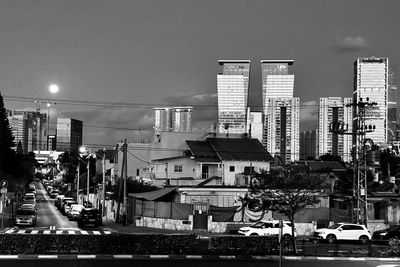 Buildings in city against sky