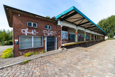 Exterior of building by street against sky