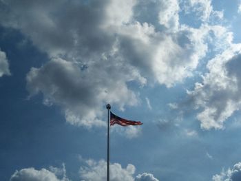 Low angle view of flag against sky