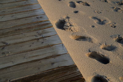 High angle view of footprints on sand