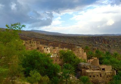 Scenic view of landscape against cloudy sky