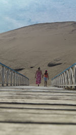 People walking on beach