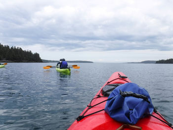 Fellow kayakers on the ocean on a cloudy day 