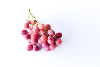 Close-up of grapes against white background