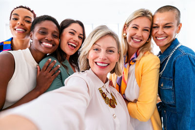 Portrait of smiling friends in office