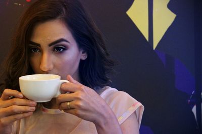 Close-up of woman drinking coffee