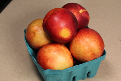 High angle view of apples in container