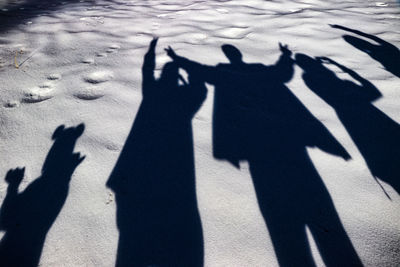 Shadow of people on sand