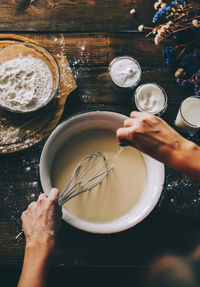 High angle view of woman preparing food on table