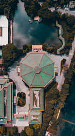 High angle view of buildings and trees in city