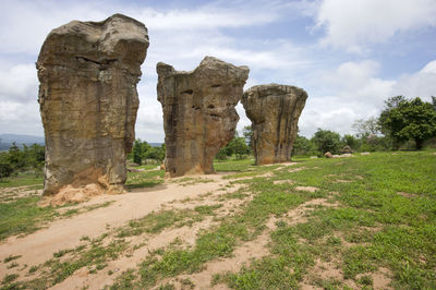 Rock formations on landscape against sky