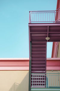 Low angle view of building against clear blue sky