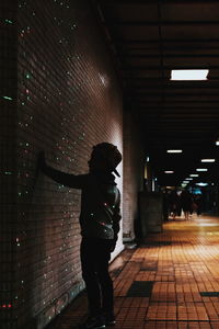 Boy standing in corridor