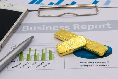 High angle view of yellow and book on table