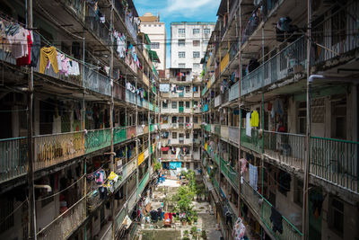 High angle view of people on street amidst buildings in city