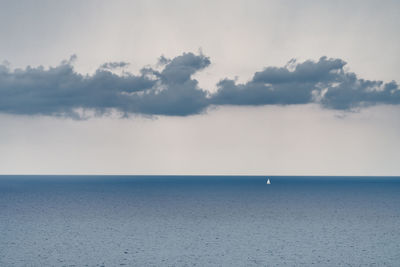 A lonely sailboat in front of ventimiglia, liguria, italy.