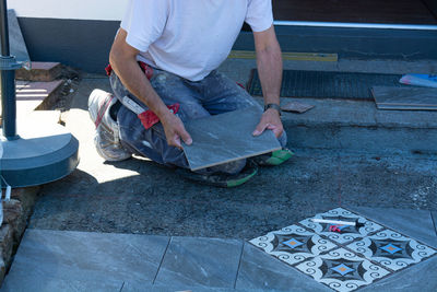 Low section of man working at workshop