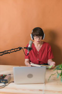 Side view of man using mobile phone