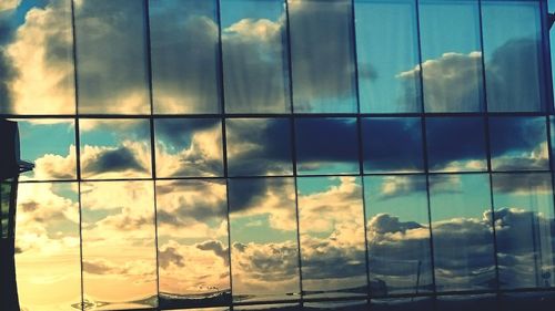 Reflection of clouds in sea at sunset