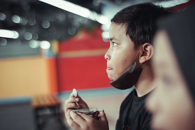 Young man holding ice cream