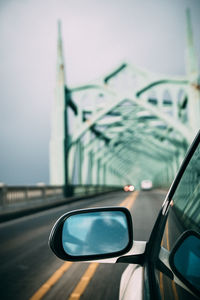 Close-up of car on road