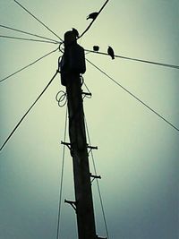 Low angle view of electricity pylon