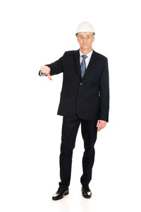 Low angle view of man standing against white background