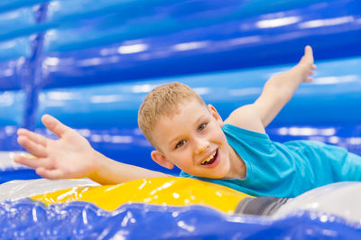 Portrait of smiling boy in swimming pool