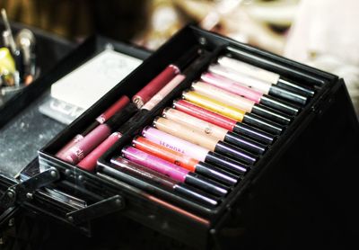Close-up of colorful beauty products in box