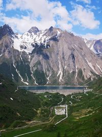 Scenic view of snowcapped mountains against sky