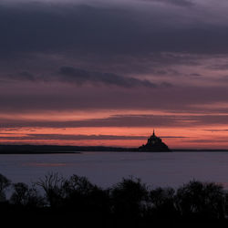 Scenic view of silhouette temple against sky during sunset