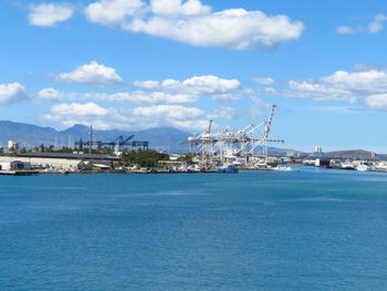 Boats in sea against sky