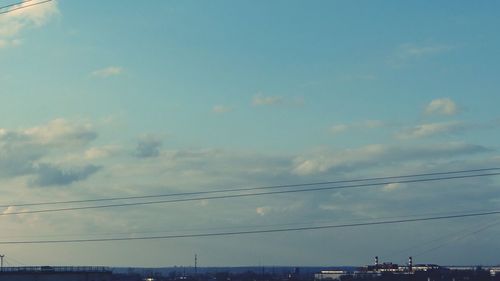 Low angle view of birds against sky