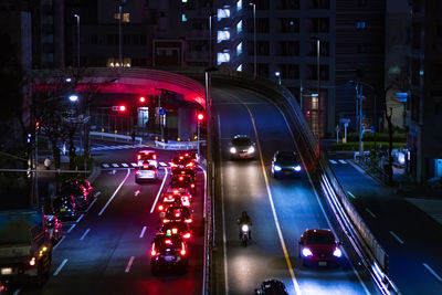 High angle view of illuminated city street at night