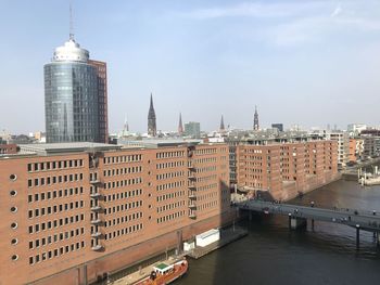 View of buildings in city against sky