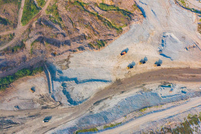 High angle view of people on rock