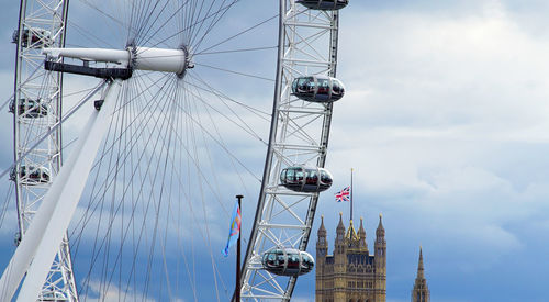 Low angle view of ferris wheel against sky