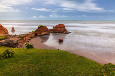 Beautiful morning view of indonesia. beach with soft coral waves and white sand