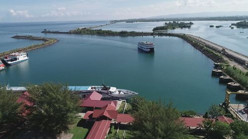 High angle view of harbor by sea against sky