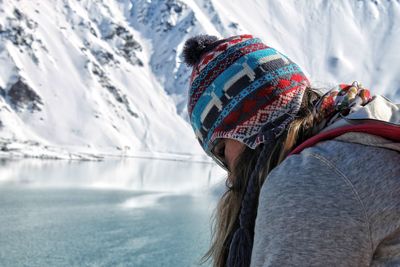 Portrait of woman wearing hat against snow during winter