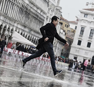 Full length of man running in rain