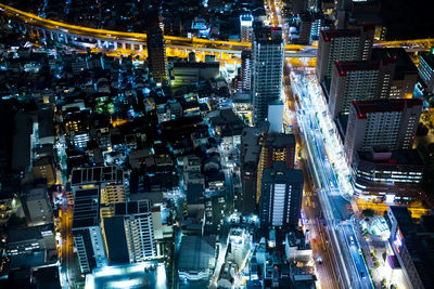 High angle view of illuminated cityscape at night