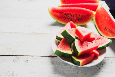 High angle view of chopped fruits on table