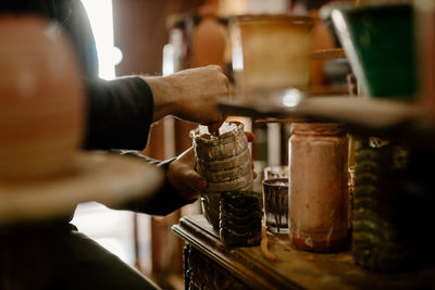 Cropped hand of man working at table