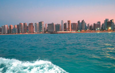 View of sea with buildings in background