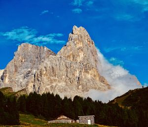 Scenic view of mountain against blue sky
