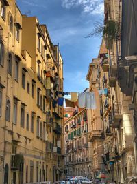 Low angle view of buildings in city against sky