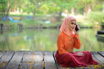 Portrait of a woman sitting outdoors