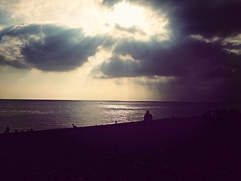 Scenic view of sea against cloudy sky