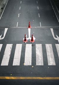 High angle view of arrow sign on road